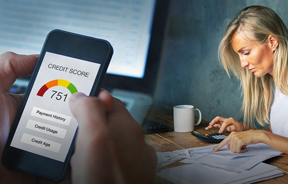 Person holding cell phone with credit score Person holding cell phone with credit score