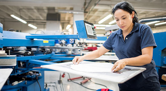 Woman doing screen printing