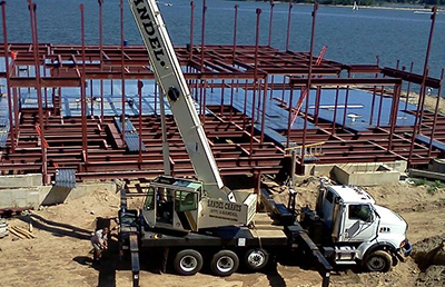 A Sandel Crane works in a construction site.