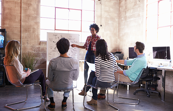 A team of entrepreuneurs learn about equipment financing in a seminar.