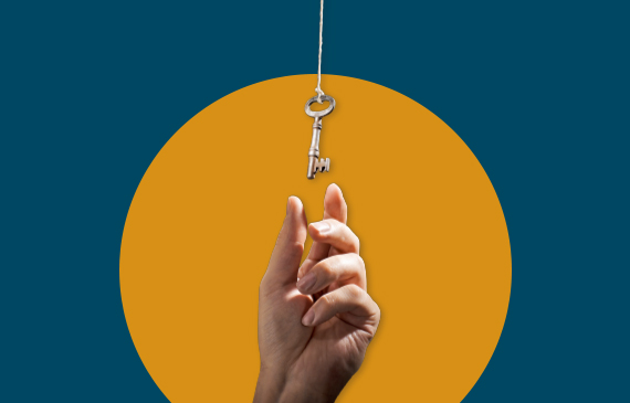 A business owner receives the key to their leased equipment after making final payment. A business owner receives the key to their leased equipment after making final payment.