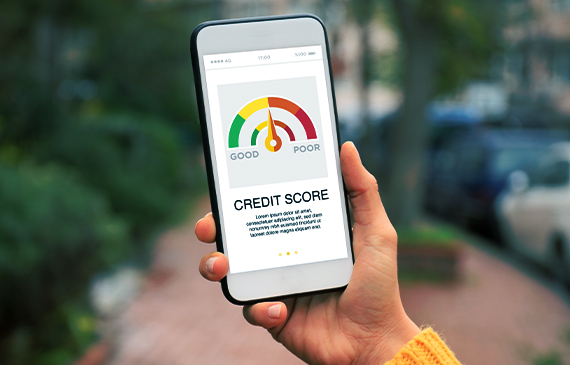 An equipment financing customer checks their business credit score on their phone. An equipment financing customer checks their business credit score on their phone.