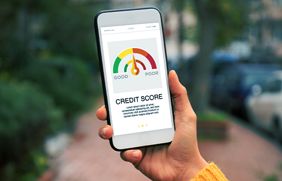 An equipment financing customer checks their business credit score on their phone.