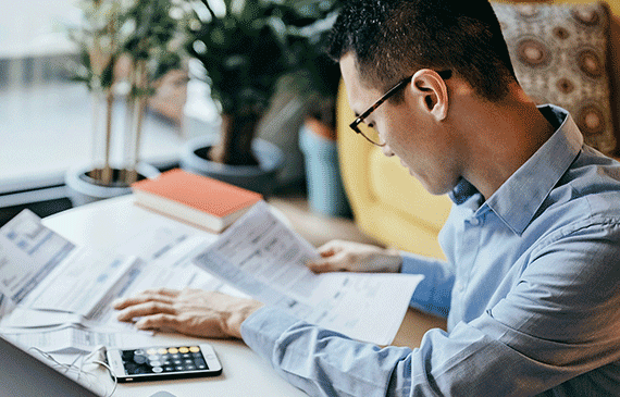business-owner-reviewing-repayment-structure-of-sale-leaseback business-owner-reviewing-repayment-structure-of-sale-leaseback