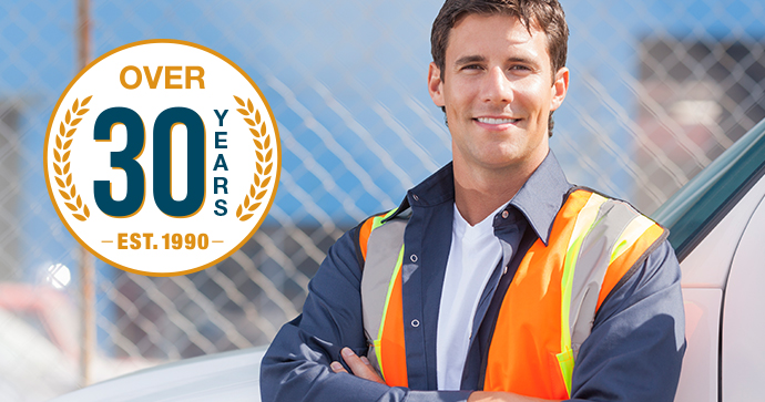 Icon of Beacon Funding's 30 years of equipment financing displays to the left of a young, male roadside assistance provider. Icon of Beacon Funding's 30 years of equipment financing displays to the left of a young, male roadside assistance provider.