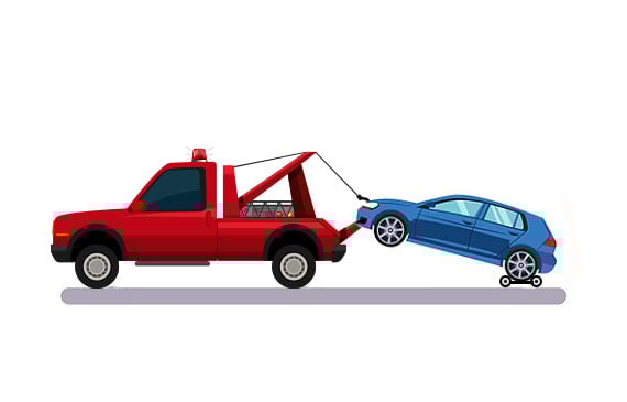 A red light-duty tow truck tows a blue Tesla electric vehicle with wheel dollies to prevent the EV's wheels from touching the ground. A red light-duty tow truck tows a blue Tesla electric vehicle with wheel dollies to prevent the EV's wheels from touching the ground.