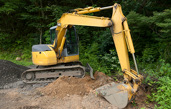 An example of a yellow mini-excavator that could be financed for a start-up landscaping company with Beacon Funding's start-up equipment financing.