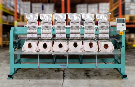 A multi-head Tajima embroidery machine sits in the shop of a business owner who financed with Beacon Funding. A multi-head Tajima embroidery machine sits in the shop of a business owner who financed with Beacon Funding.
