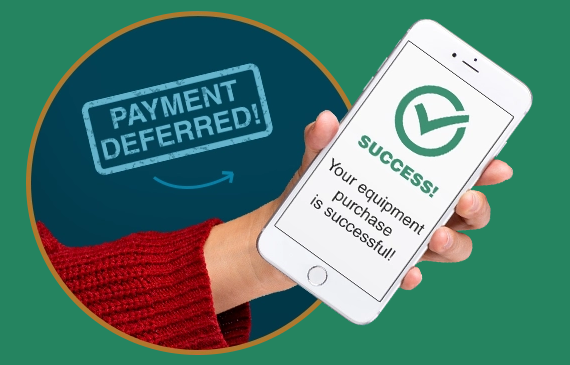 A business owner holds a mobile phone with the message "Payment Deferred! Your equipment financing payment is successful!" flashing on their screen. A business owner holds a mobile phone with the message "Payment Deferred! Your equipment financing payment is successful!" flashing on their screen.