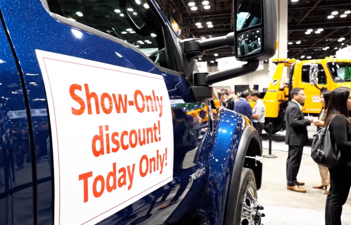 Commercial truck at a tradeshow with a ‘Show‑Only Discount Today’ sign, highlighting how Beacon Funding equipment financing helps businesses take advantage of limited‑time deals without tying up cash.