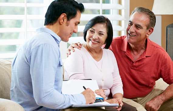 An advisor talks to a business owner about leasing equipment.