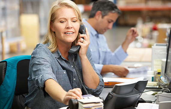 A manager preps her team during a conference call.