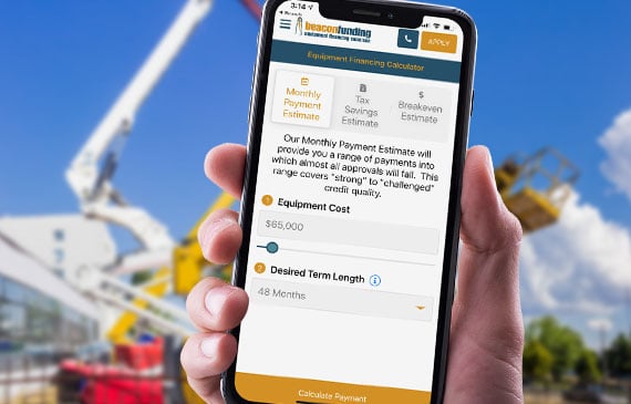 An entrepreneur uses their mobile device to calculate a low monthly payment for their next boom truck. An entrepreneur uses their mobile device to calculate a low monthly payment for their next boom truck.