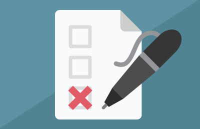 A black pen marks an "x" on a checklist. A black pen marks an "x" on a checklist.