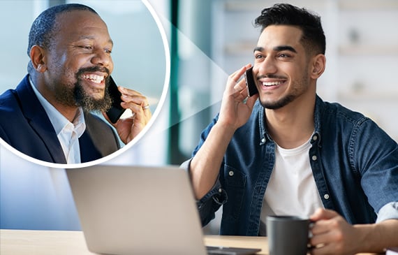 A young male business owner speaks with his certified public accountant in a cellphone call while drinking a cup of coffee.
