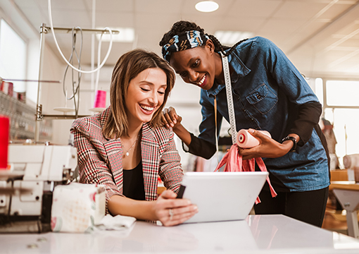 Women looking at computer smiling