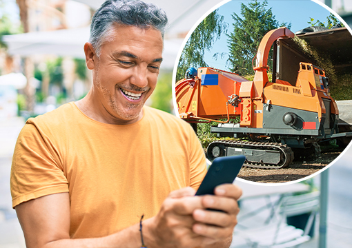 Man looking at equipment on phone, excited.