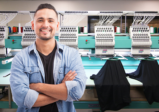 Man using screen printing machine