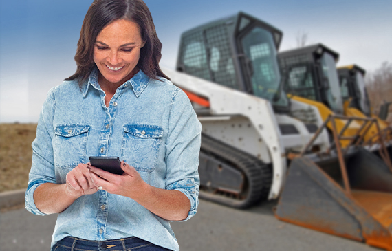 A business owner applies for compact track financing using their mobile phone. A business owner applies for compact track financing using their mobile phone.