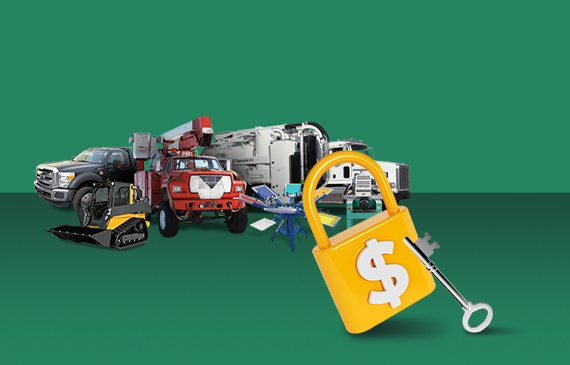 A yellow lock and silver key stands in front of a group of equipment, including a tow truck, skid steer, boom truck, septic truck, and screen-printing press.